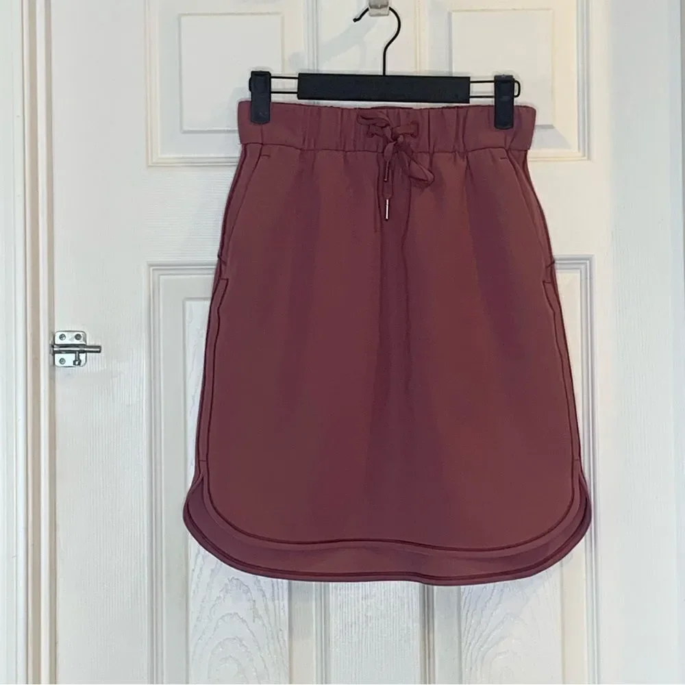 Lululemon on the fly skirt, color: cherry cola, size 4